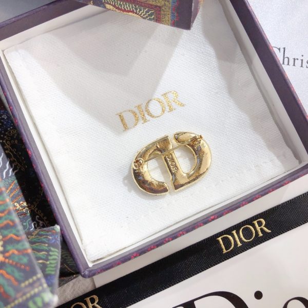 DIOR CD BROOCH GOLD WITH STONES ATTACHED