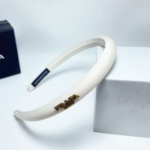 PRADA SMALL PRADA MILANO HEADBAND WITH GOLD HARDWARE IN WHITE