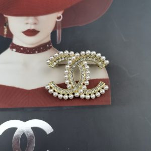 CHANEL CC BROOCH GOLD WITH STONES ATTACHED AND PEARLS