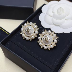 CHANEL SUNBURST PEARL AND CRYSTAL EARRINGS IN GOLD TONE