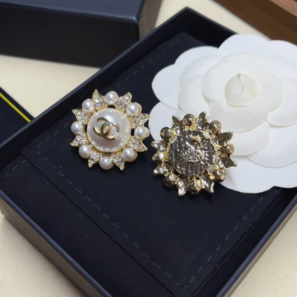 CHANEL SUNBURST PEARL AND CRYSTAL EARRINGS IN GOLD TONE