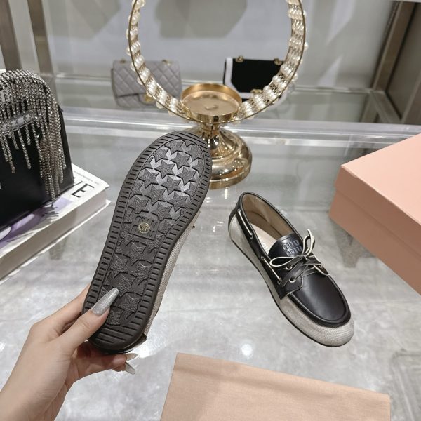 MIUMIU CANVAS AND BLEACHED LEATHER BOAT SHOES BLACK