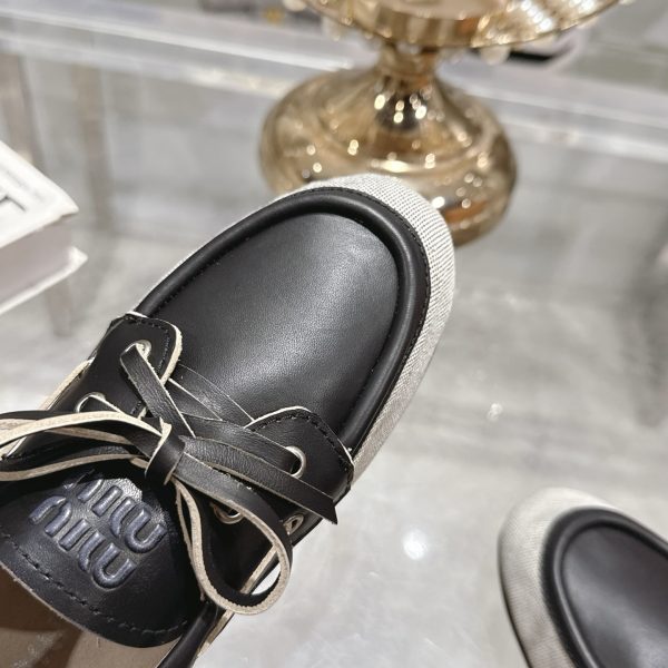MIUMIU CANVAS AND BLEACHED LEATHER BOAT SHOES BLACK