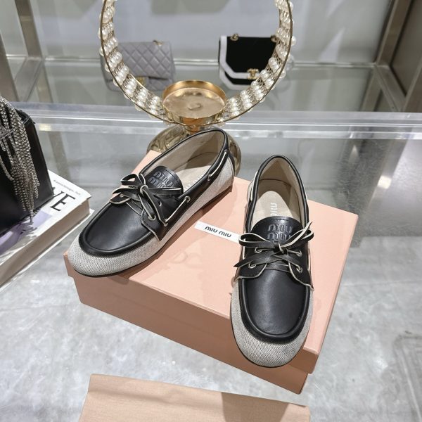 MIUMIU CANVAS AND BLEACHED LEATHER BOAT SHOES BLACK