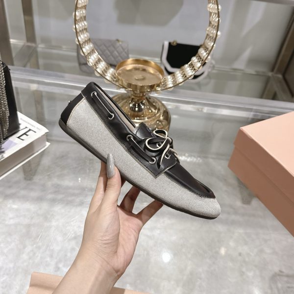 MIUMIU CANVAS AND BLEACHED LEATHER BOAT SHOES BLACK