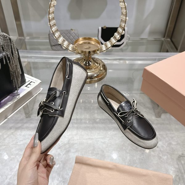 MIUMIU CANVAS AND BLEACHED LEATHER BOAT SHOES BLACK