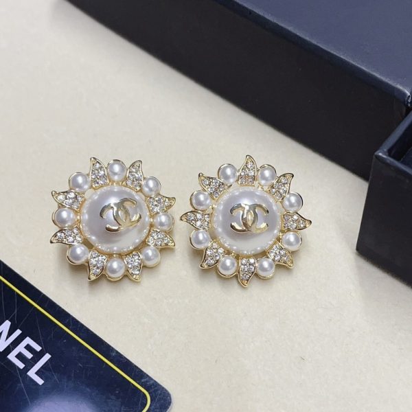 CHANEL SUNBURST PEARL AND CRYSTAL EARRINGS IN GOLD TONE